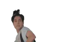 a man with his hair in a bun is making a face