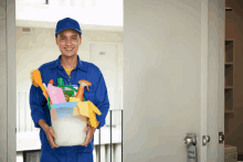 a man is holding a bucket of cleaning supplies in front of a door that says please clean up