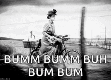 a black and white photo of a woman riding a bicycle with the words bumm bumm buh bum bum