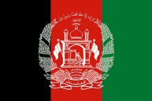 the flag of afghanistan is red green and black with a white emblem