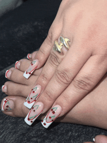 a close up of a woman 's hand with a ring on her finger