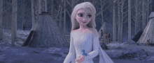 a girl in a white dress is holding a blue bird