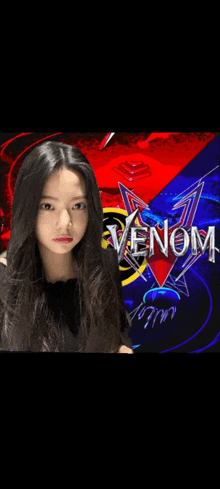 a girl with long hair stands in front of a poster for venom