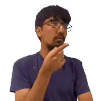 a man wearing glasses and a blue shirt is pointing