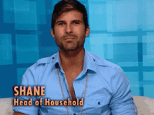 a man in a blue shirt with shane head of household written above him