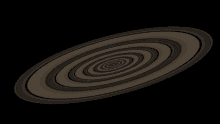 a black background with a swirl of circles