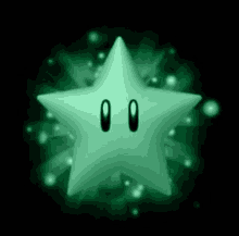 a green star with two eyes is glowing in the dark on a black background .