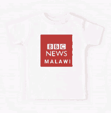 a white t-shirt with a red square with the bbc news malawi logo on it .