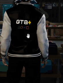 a man wearing a black and white varsity jacket that says ' gta + ' on it