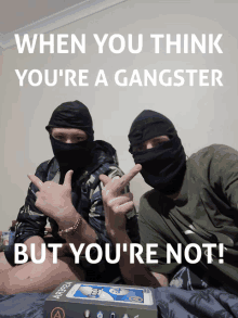 two men wearing face masks are posing for a picture with the caption when you think you 're a gangster but you are not