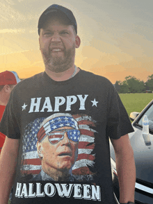 a man is wearing a black shirt that says happy halloween