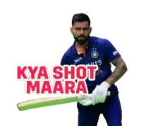 a man in a blue shirt holding a bat with the words kya shot maara behind him