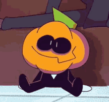 a cartoon pumpkin is sitting on the floor with a green hat on .