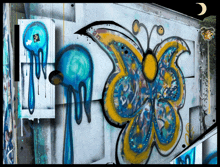 a butterfly is painted on a wall next to a box with a sticker on it