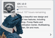 a cookie monster sits next to a screen that says ios 10.0 apple inc. about 107 hours remaining