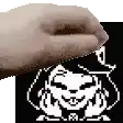 a hand is reaching out towards a pixel art of a cat .