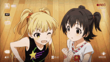 two anime girls are standing next to each other in front of a camera that is recording them