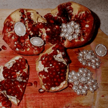 a pomegranate that has been cut in half with pearls and diamonds