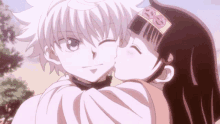 a girl is kissing a boy on the cheek in an anime scene