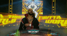 a wrestler named ricochet is on the stage