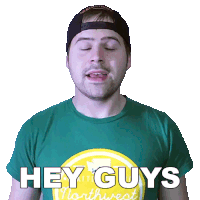 a man wearing a green shirt with the words hey guys on it