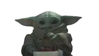 a baby yoda is holding a white box with red berries in it