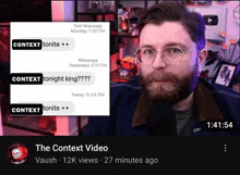 a man with glasses and a beard looks at the camera in front of a screen that says ' the context video ' on it