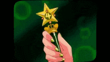 a person is holding a golden object with a star on it .