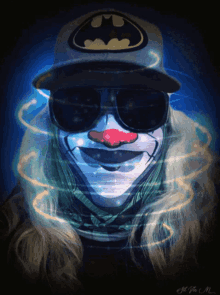 a clown wearing a batman hat and sunglasses has a red nose