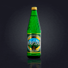 a green bottle with a gold label that says hap3ah