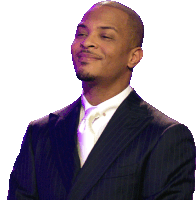 a man in a suit and tie is smiling and looking to the side