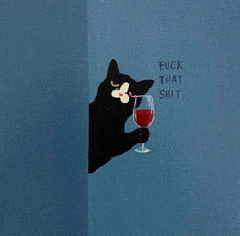 a black and white cat is holding a glass of red wine .