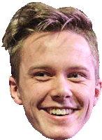 a close up of a young man 's face smiling with braces on his teeth .