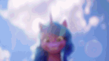 a blurred image of a pink unicorn with blue hair