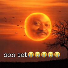 a sunset with a man 's face on the sun and the words son set below it