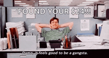 a man is sitting at a desk in an office cubicle with his hands behind his head and the words `` found your $ 24 ! ''