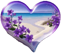 a purple heart with purple flowers on it and a beach in the background