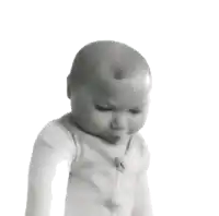 a black and white photo of a baby making a funny face on a white background .