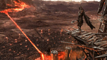 a man with a sword is standing on a ledge overlooking a city with lava coming out of it