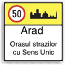 a sign that says arad on it with a city in the background