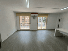 an empty office with a clock on the wall