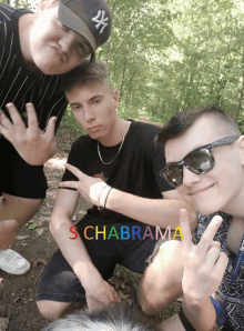 three young men posing for a picture with a rainbow colored background that says s chabrama