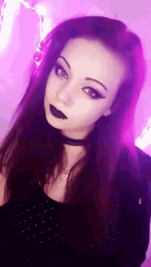 a woman with purple hair is wearing a choker and black lipstick