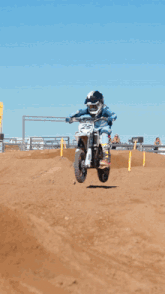 a person riding a dirt bike with the number 25