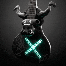 a guitar with a skull on it that says x / x