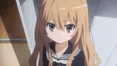 a close up of a girl with long hair wearing a sailor suit .