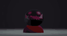 a black sphere with purple eyes and teeth on a red base