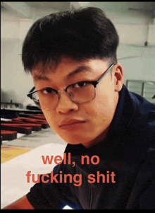 a young man wearing glasses has the words well no fucking shit written on his face