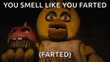 chica from five nights at freddy 's is holding a red cupcake and says " you smell like you farted "