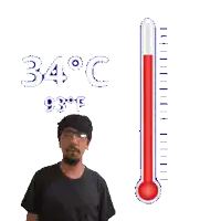 a man stands in front of a thermometer reading 34 degrees celsius